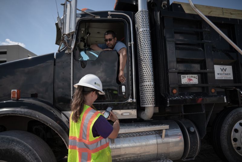 truck driver talking with project manager